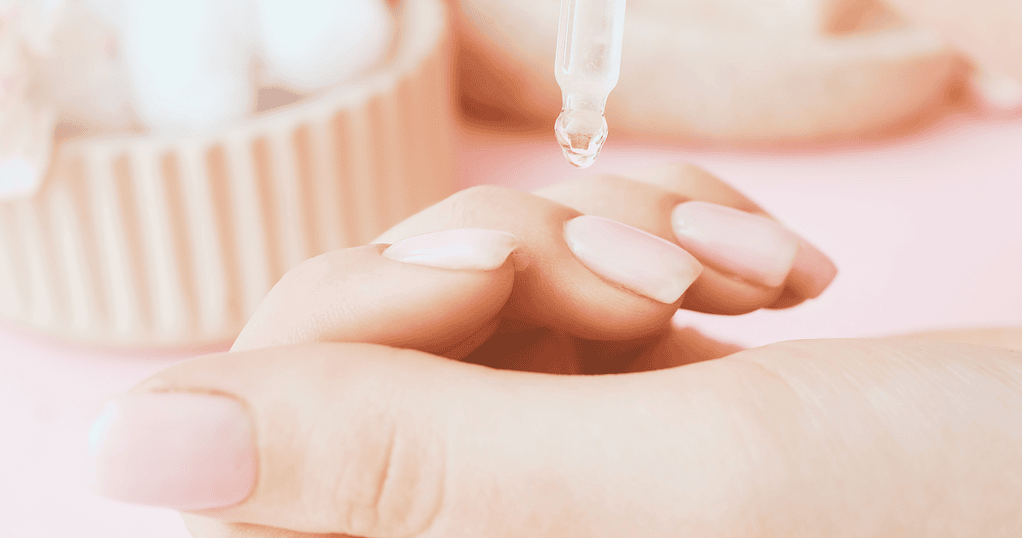 A close-up of a hand receiving a skincare treatment with a dropper, highlighting relaxation, wellness, and natural beauty. Perfect for promoting holistic beauty and spa services at The Flower Pot.