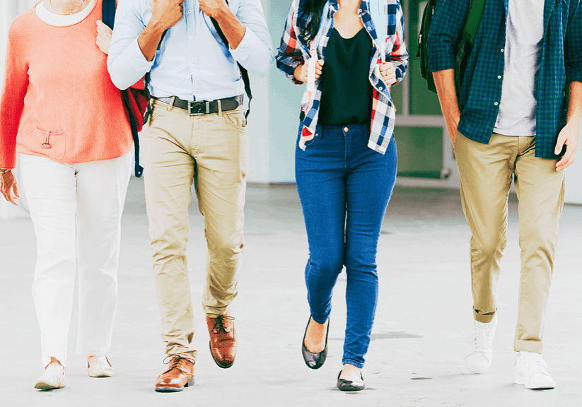 Wide-angle shot of a diverse group of young professionals walking together in a modern office environment, conveying teamwork, collaboration, and a professional yet relaxed atmosphere.
